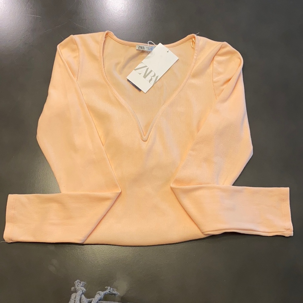 ZARA. Women’s ribbed peach bodysuit.